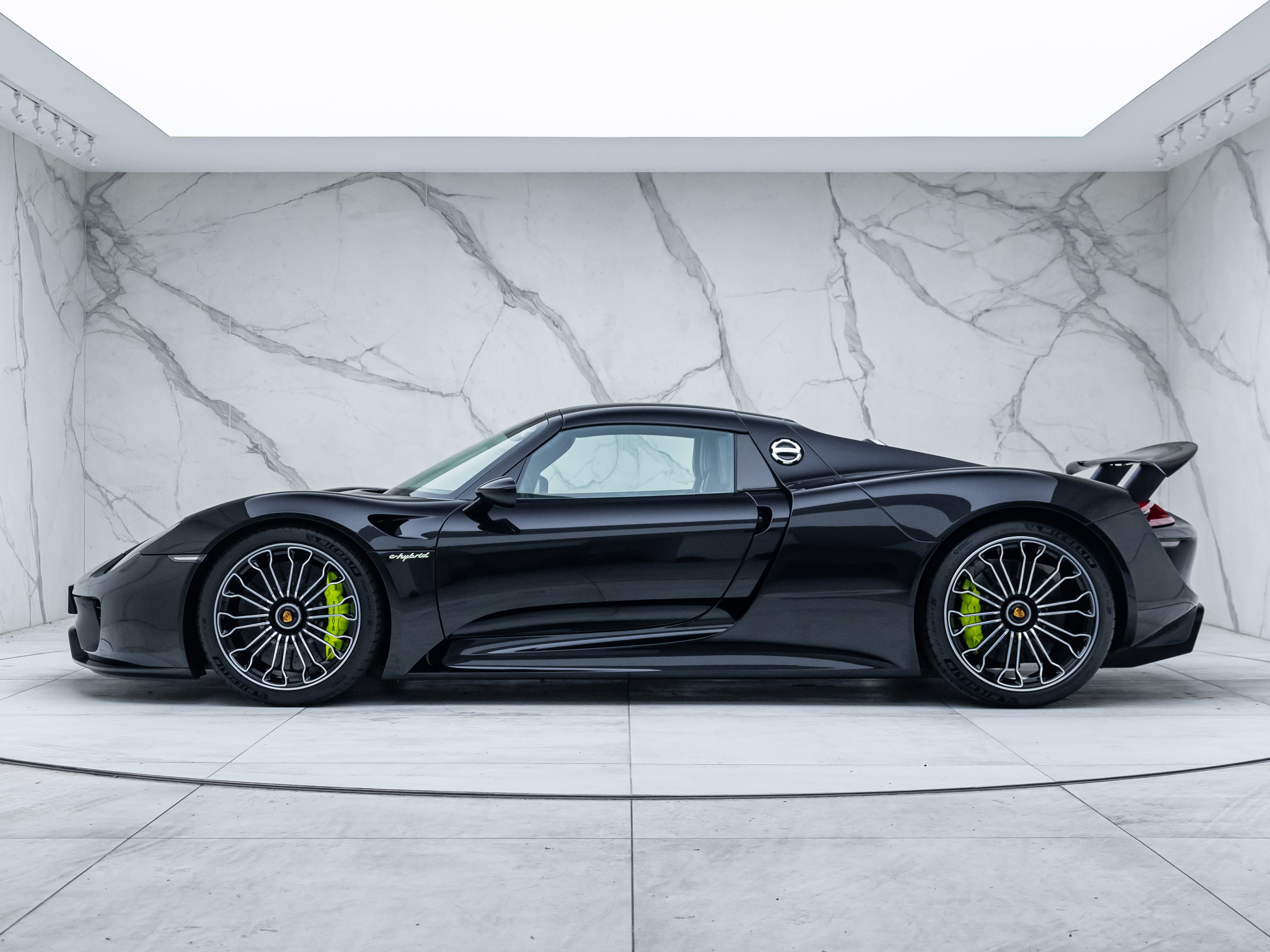 Porsche 918 Spyder side profile in the showroom